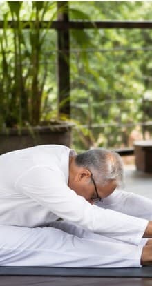 Guruji demonstrating Seated Forward Bend